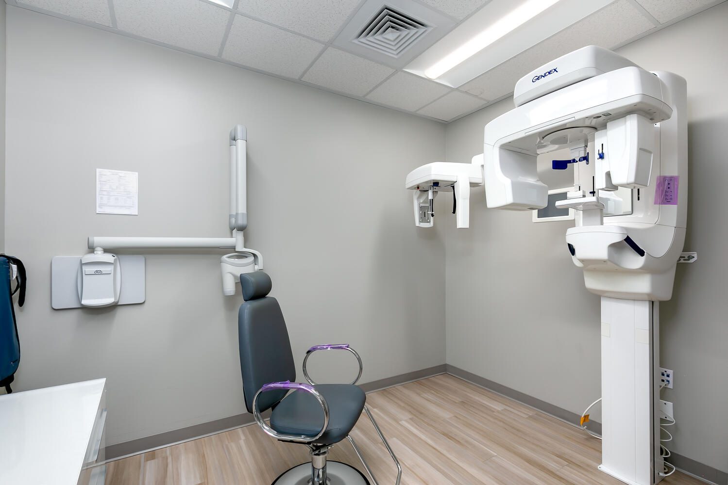 Dental office with x-ray equipment and chair.