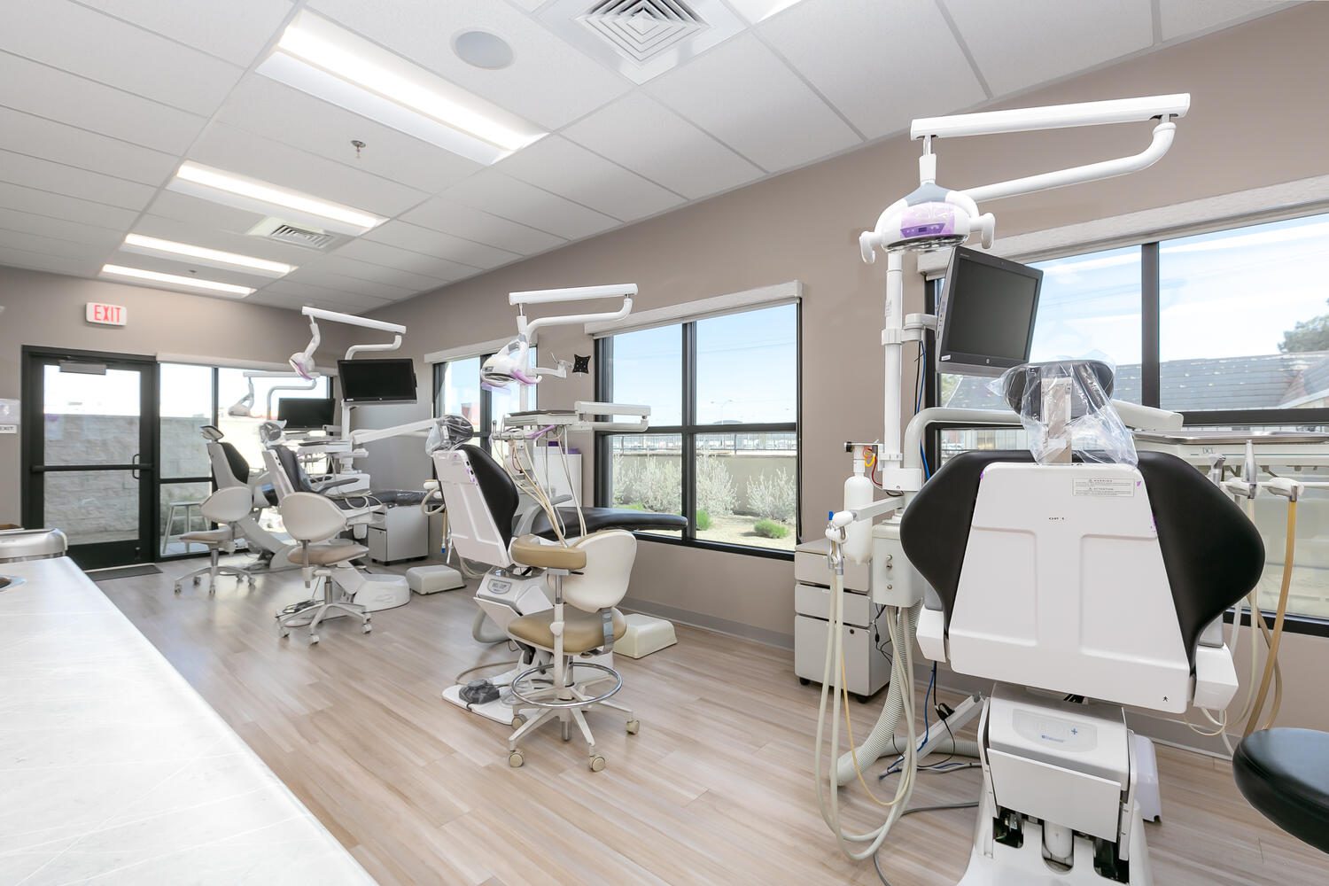 Dental office with multiple examination chairs.