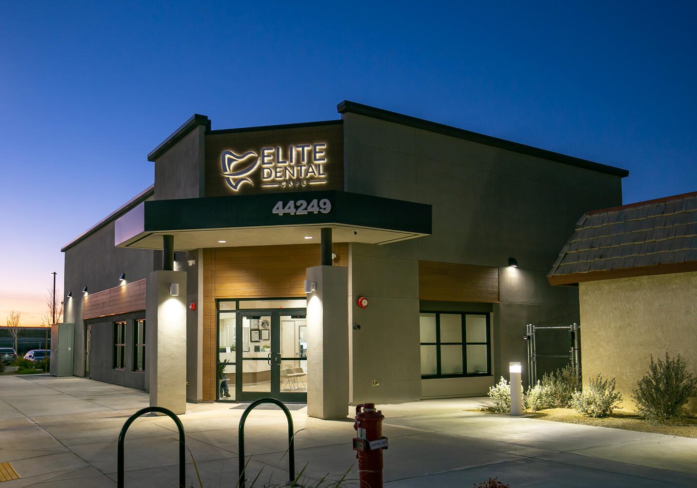 Elite Dental building at twilight.