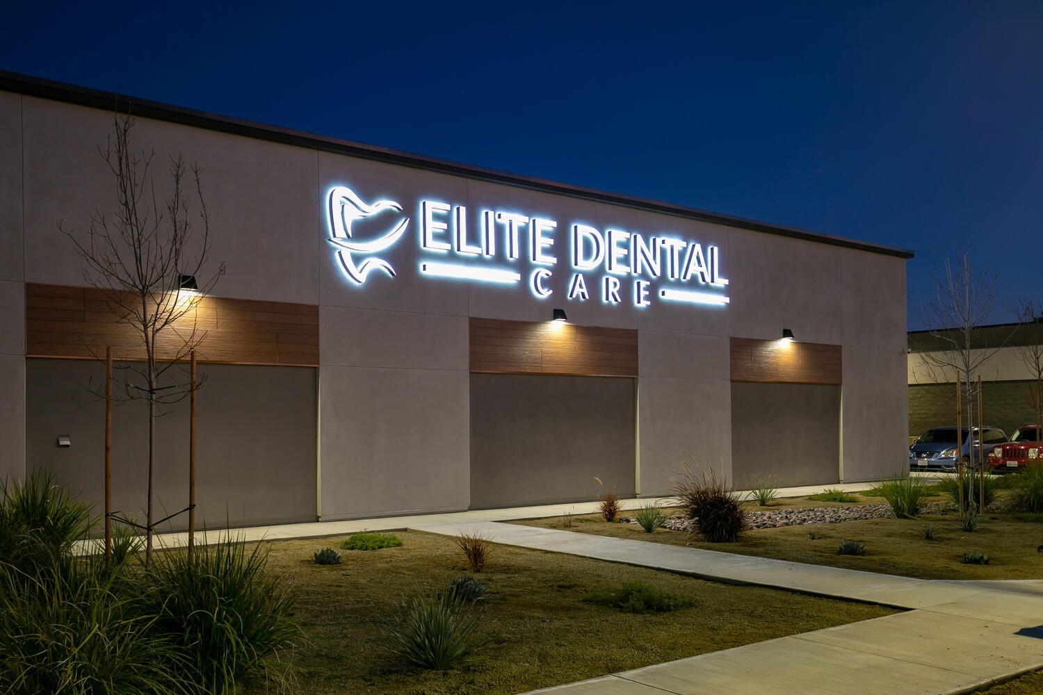 Illuminated sign for Elite Dental Care.